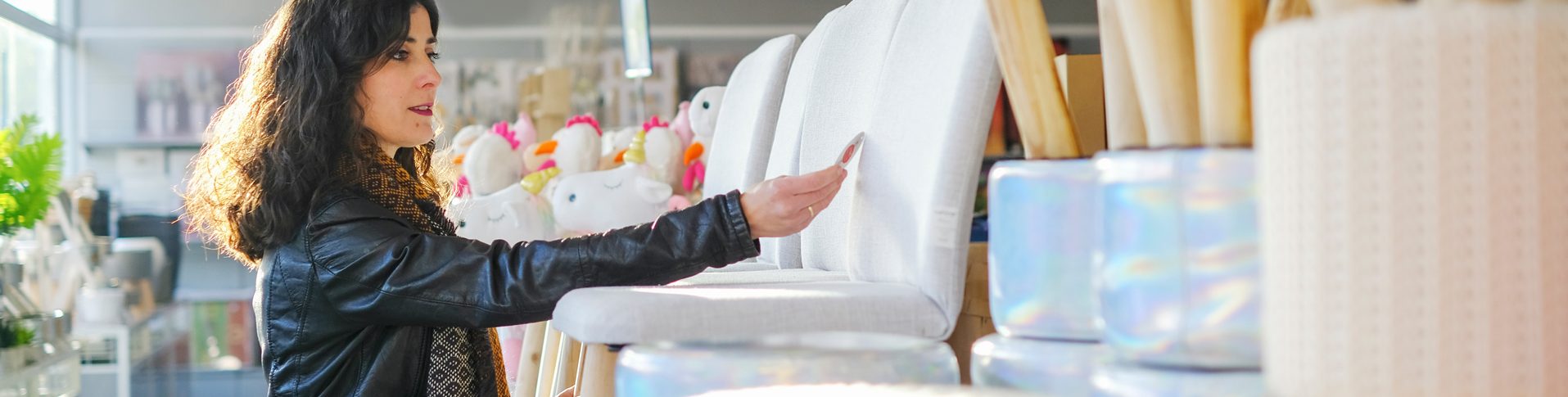 A woman takes advantage of a sale at a furniture store