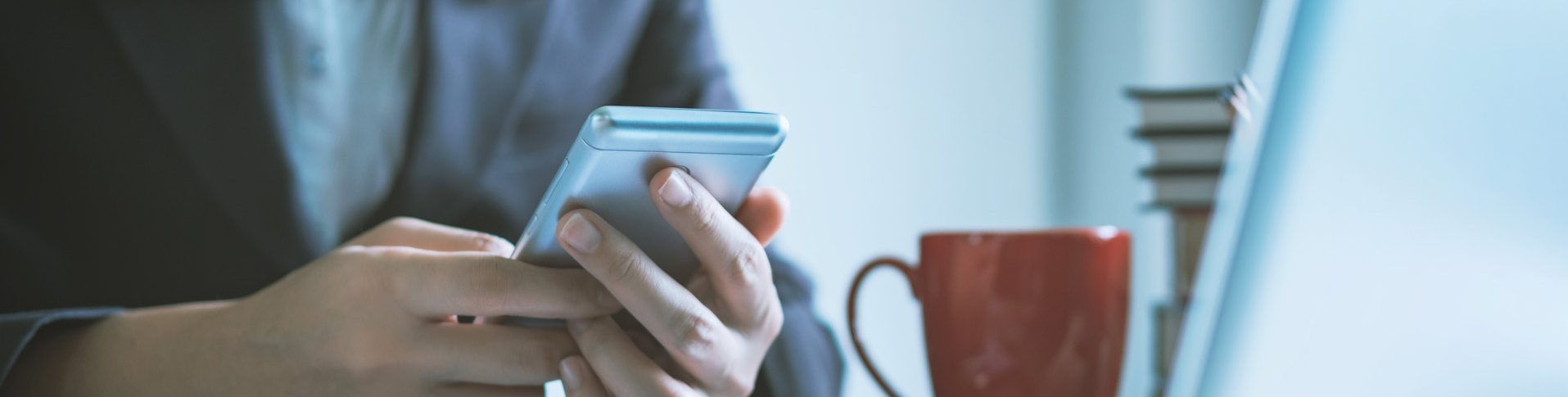 A woman checks her cellphone